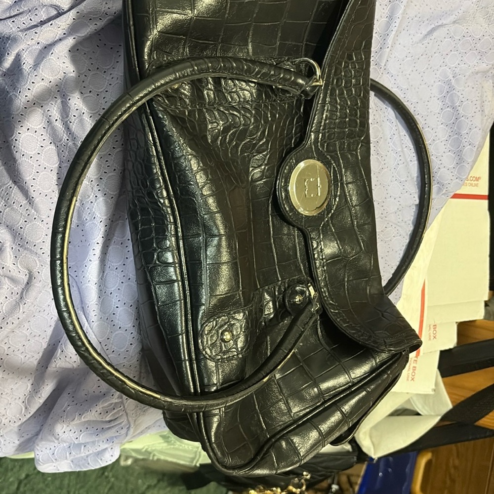 Sleek Black Leather Shoulder Bag with Metal Hoop Handle